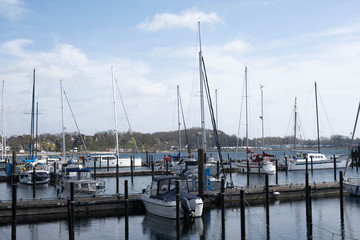 Fototapeta premium many yachts stand at the port in a European city