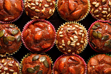 Homemade muffins with the addition of various nuts seeds and spices view from above, close up 