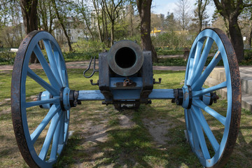an ancient cannon that shoots nuclei stands muzzle forward