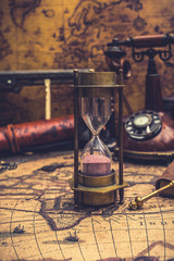 Hourglass On Old World Map