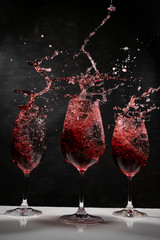 red wine in a wine glass with black background