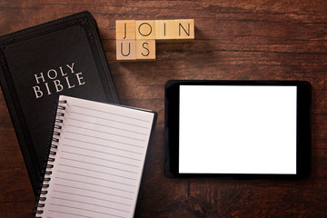 Join Us in Block Letters on a Wooden Table with a Holy Bible