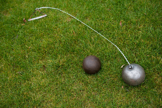 Hammer and shot put on the grass, track and field equipment