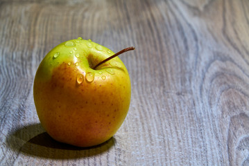 yellow and red apple on the table