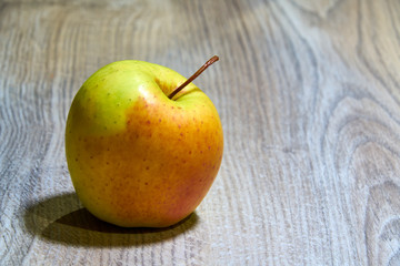 yellow and red apple on the table