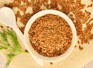 flax seeds in a white cup