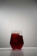juice splash in a drinking glass