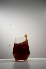 juice splash in a drinking glass