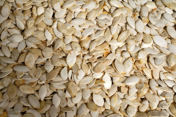 Macro background texture of dried pumpkin seeds