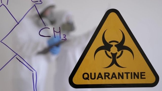 Quarantine. Quarantine warning sign on a glass door in hospital isolator. Isolation of patients with the virus in special laboratories. Virus.