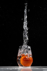 tomato water splash in a drinking glass