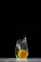  lemon water splash in a drinking glass