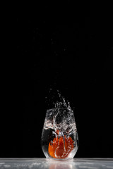 tomato water splash in a drinking glass