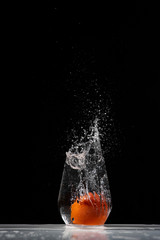 tomato water splash in a drinking glass