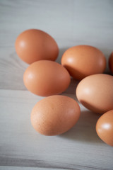 Organic eggs on a wooden background