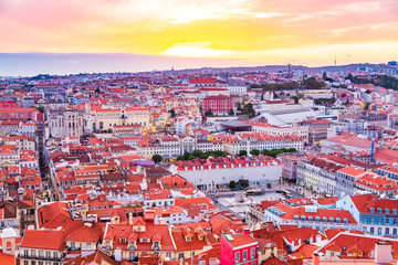 Naklejka premium Beautiful panorama of old town and Baixa district in Lisbon city during sunset, seen from Sao Jorge Castle hill, Portugal