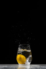  lemon water splash in a drinking glass
