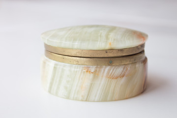 luxurious natural onyx jewelry box on white marble. top view, minimalism concept. vintage casket onyx.