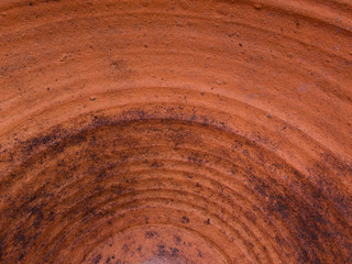 Inside of a terracotta pot with residual earth visible