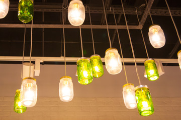 ceiling lights under a dark ceiling made of canned glass painted in different colors