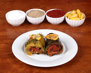 Eggplant and green bell peppers with delicious vegetables Ready to serve on a plate with special Turkish spices on a wooden table