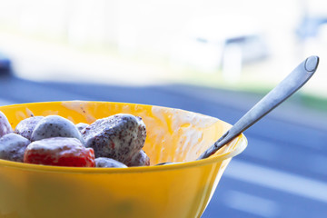 Beautiful fresh strawberries in plastic containers stands on the table