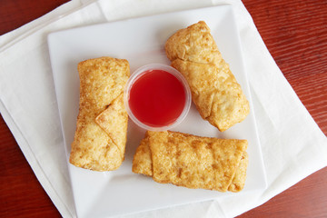 Classic Chinese egg rolls and sweet and sour sauce