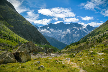 Fototapeta na wymiar Beautiful view on majestic Alps with Fee glacier above the Saas-Fee village in Switzerland