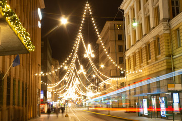 Central street Aleksanterikatu with festive bright illumination and Christmas atmosphere in the city of Helsinki in Finland. The letter "A" traditionally means the street Aleksanterikatu