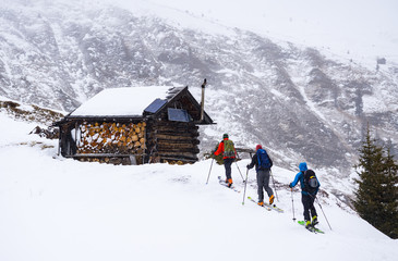 skitouring group reaching the hut