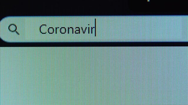 Browser bar with Coronavirus prevention text typed on the computer monitor. Shot in 4k resolution