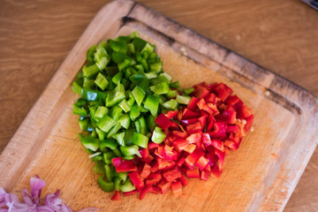 Fototapeta na wymiar Heart shaped pepper cutting