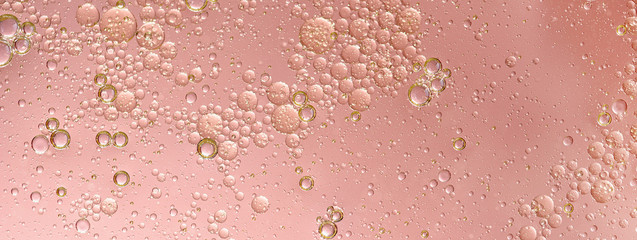 oil with bubbles on on dark blue background. Abstract background.