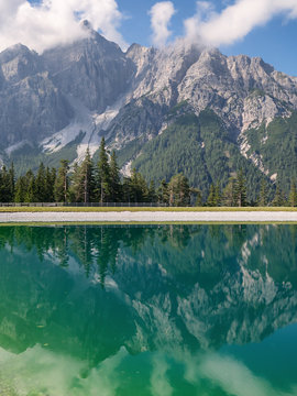 View of peak Serles reflected in the Serlesseen retention basin, Stubai Valley, Innsbruck-Land, Tyrol, Austria