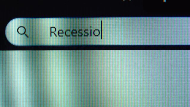 Browser bar with recession word typed on the computer monitor. Shot in 4k resolution