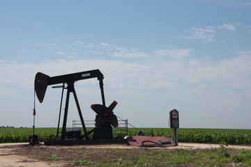 oil pumping rig in empty field