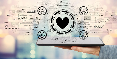 Get more likes concept with man holding a tablet computer