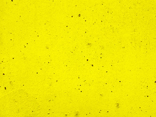 Blank yellow cement plaster texture surface of wall background.