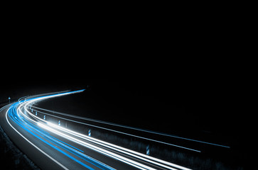 blue car lights at night. long exposure