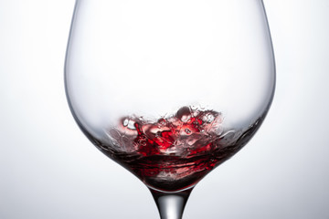 red wine in a glass with a splash
