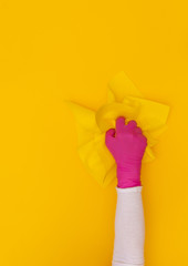 Hand yellow protective pink glove hand rag wiper background
