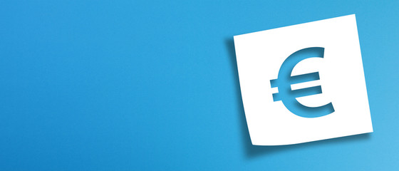 Note paper with euro sign on panoramic blue background