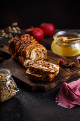 Swirl brioche or traditional Polish babka cake with walnut, apple and honey