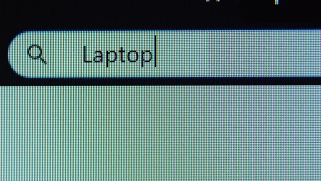 Browser bar with laptop word typed on the computer monitor. Shot in 4k resolution