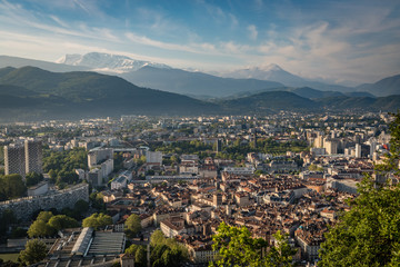 Bright sunny morning with the old section of Grenoble France and the French Alps in the background
