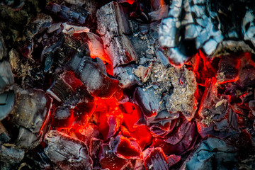 Firewood and hot coal on the grill. Hot charcoal.