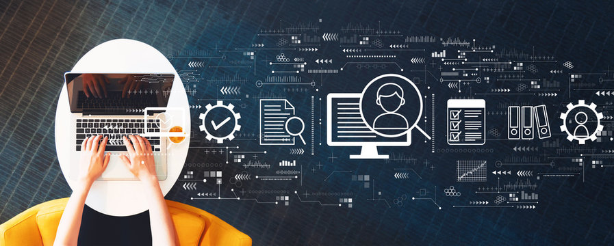 Document management system concept with person using a laptop on a white table