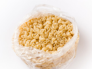 Uncooked macaroni elbow shape pasta with white background stock image. 
