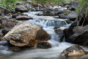 Naklejka na ściany i meble Wild Waterfall in the mountains with long exposure