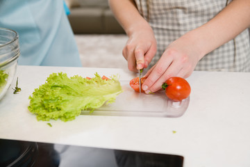 Close up hand cut tomato for salad